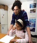 mother working with daughter at home