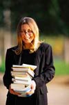 smiling woman with books