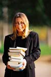 smiling woman with books