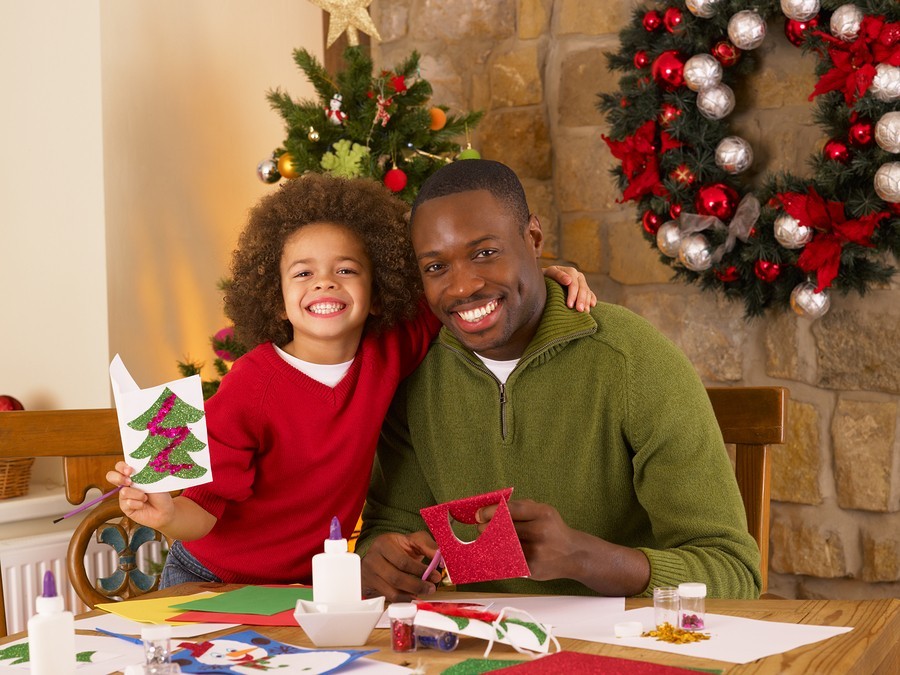 family with Christmas wreath