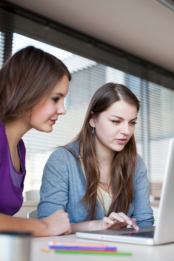 girls study at computer