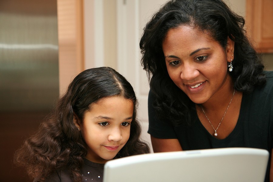 evaluator and boy reading together