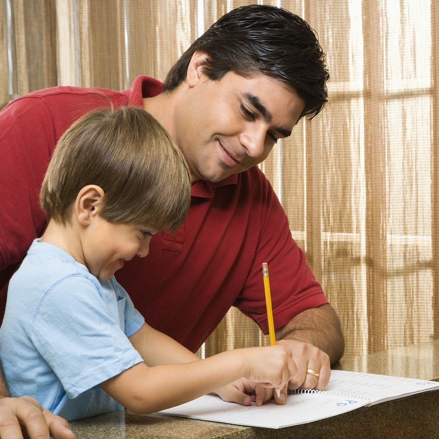 dad and boy do school work