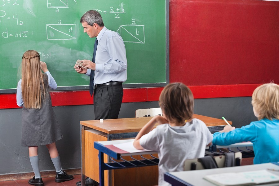 image of teacher and student at math blackboard