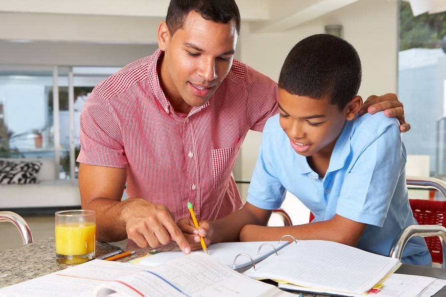 dad and son work on homework