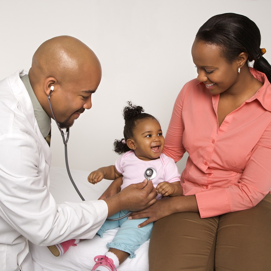 Mother with young daughter and pediatrician.