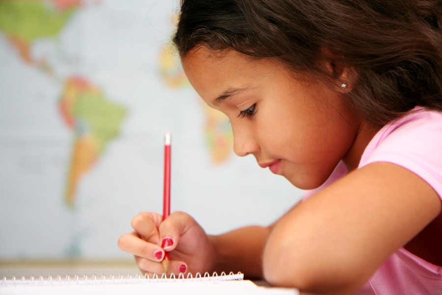 girl writing in school