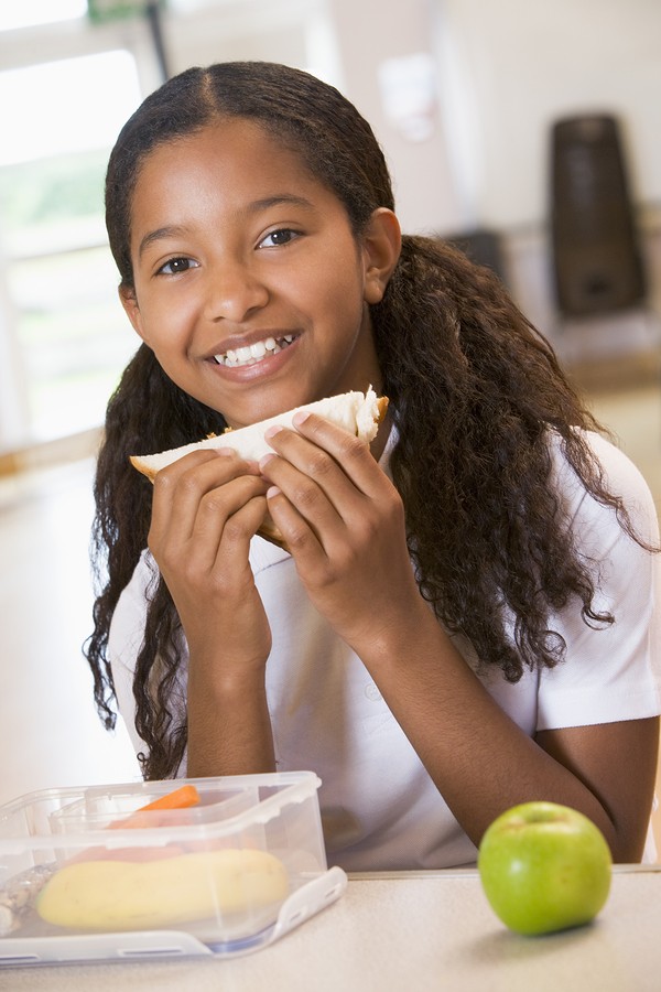 girl eats lunch at school