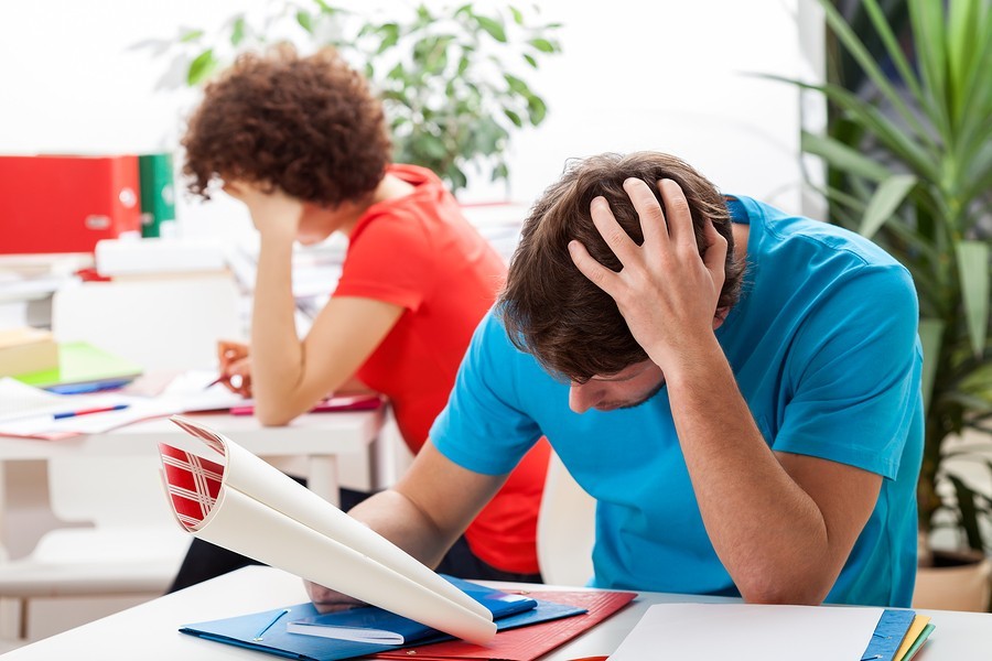 teen boy at school in class