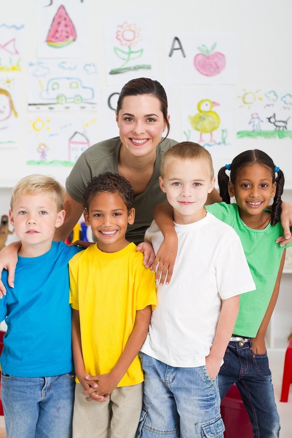 happy kindergarten kids with teacher