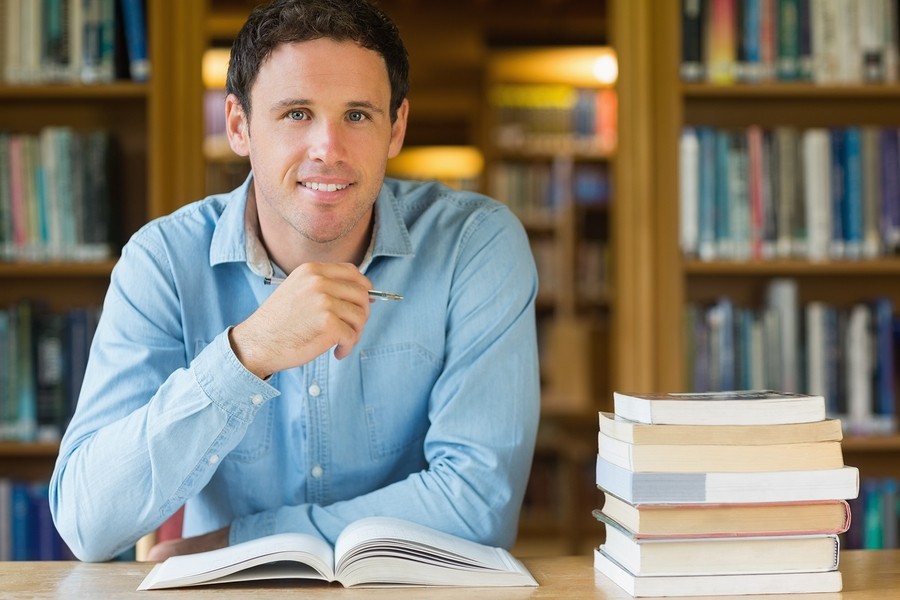 man reading in library