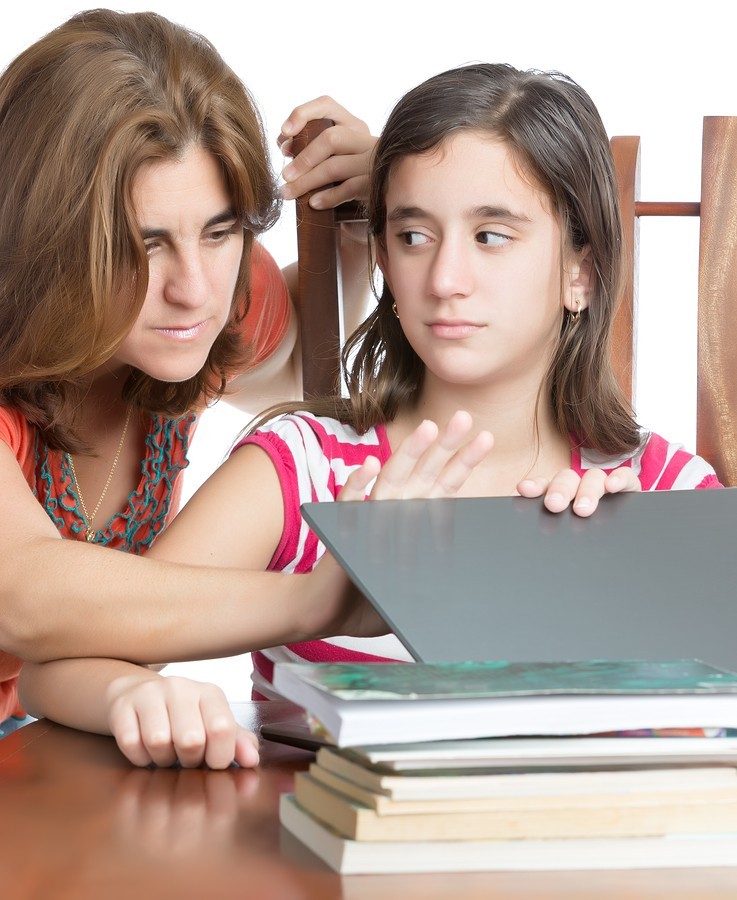 Mom helps daughter with homework