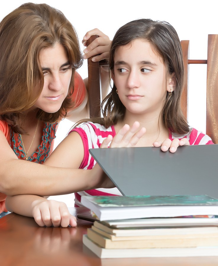 girl students gets help from mom on work