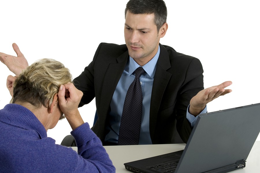 man and woman in conflict at meeting