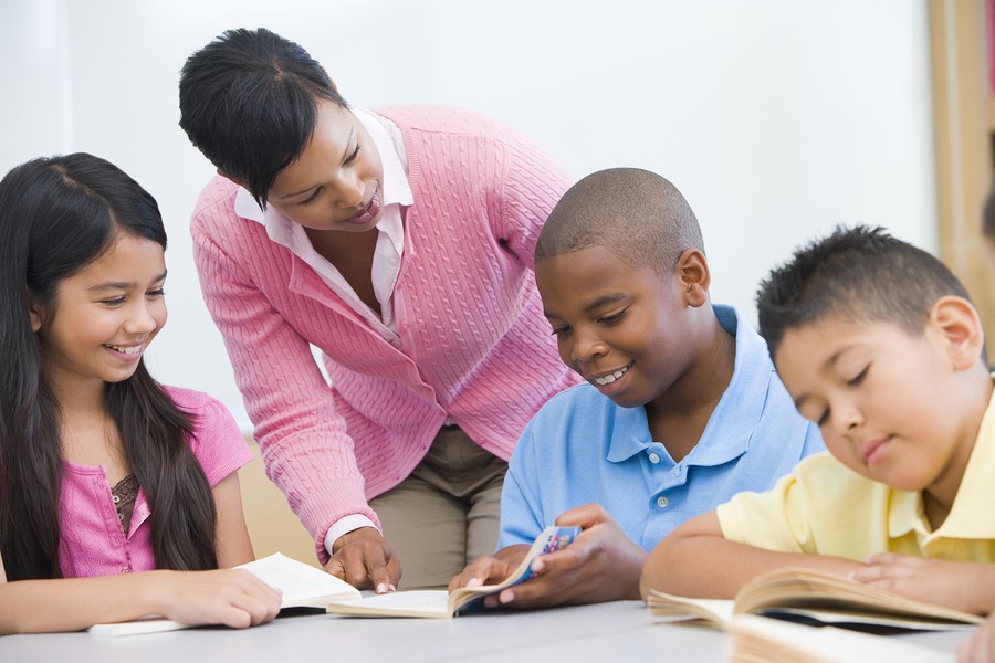 kids with teacher in classroom