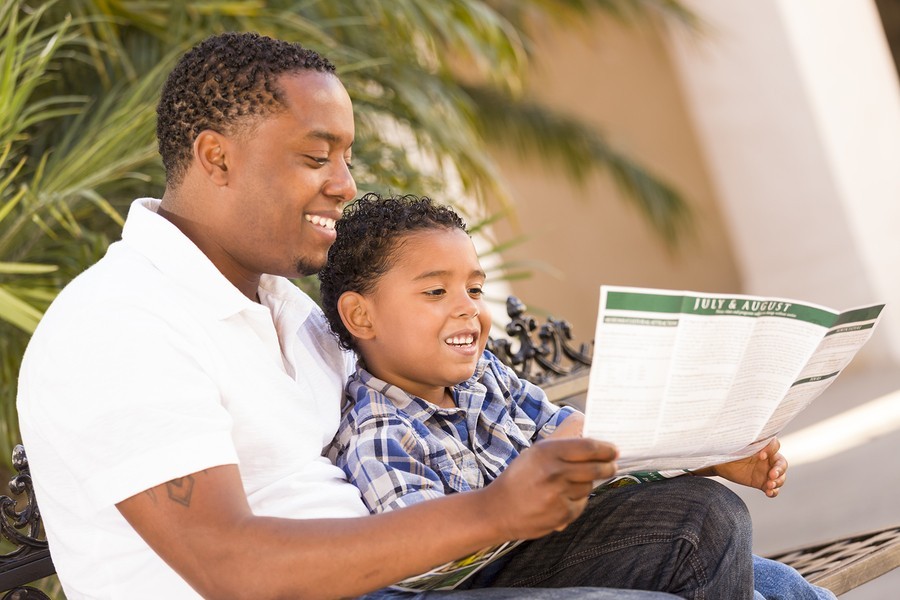 father and son reading