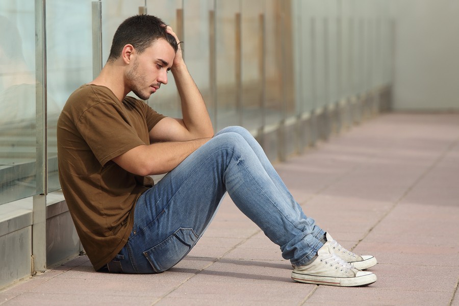 boy alone at school by lockers