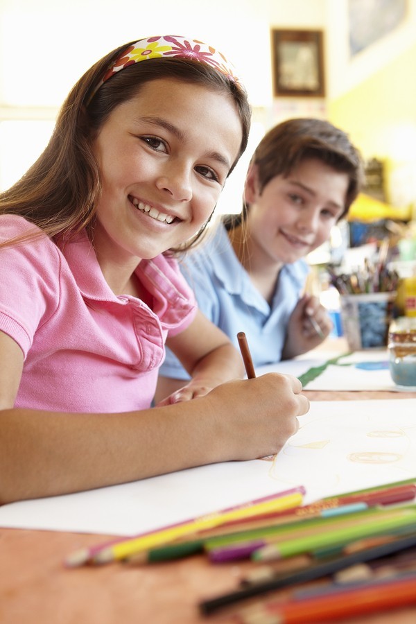 two students at desks in school