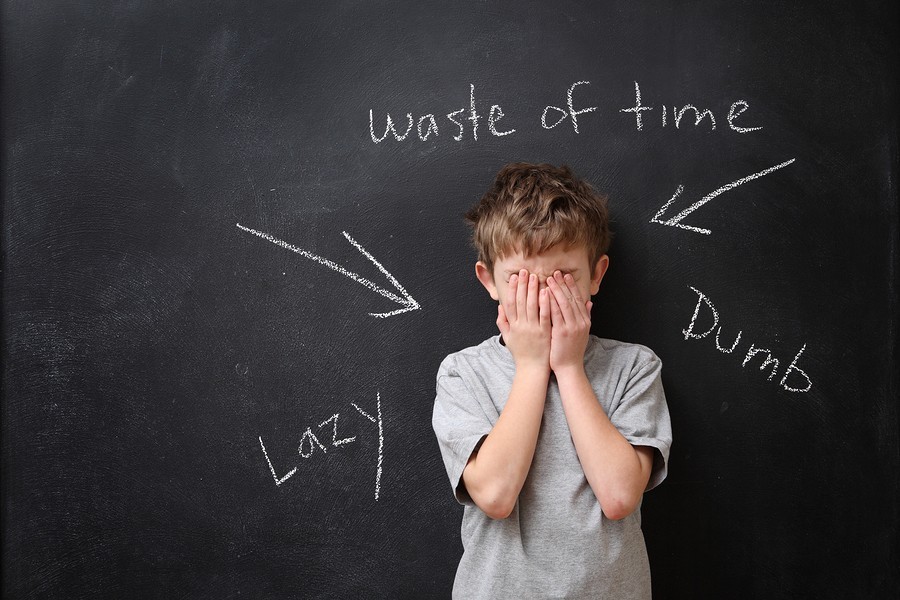 frustrated boy at blackboard