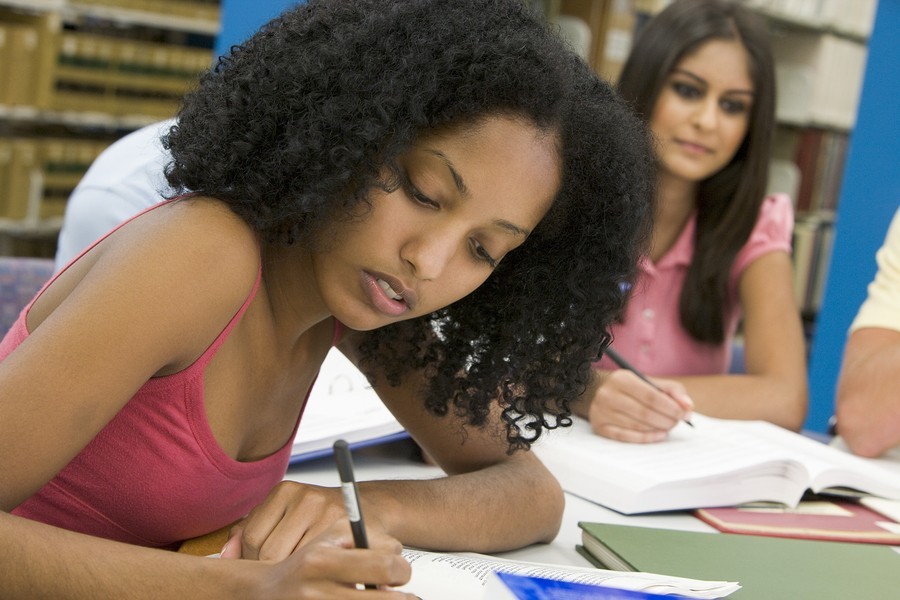 girl writing at school