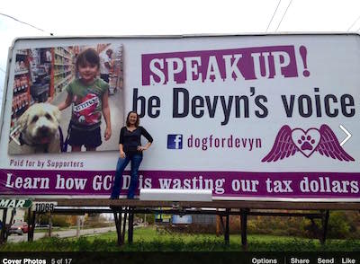 Speak Up! Heather in front of blllboard near school