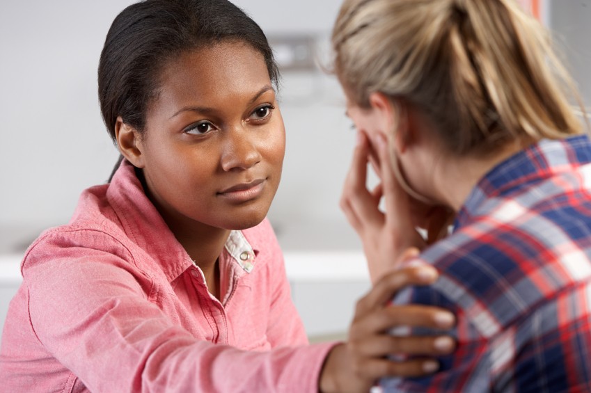 image of concerned mom with school staff