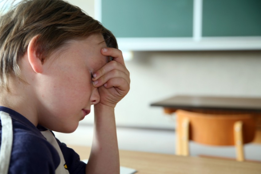 boy appears upset when struggling in school
