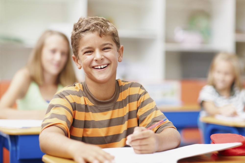 boy in school class