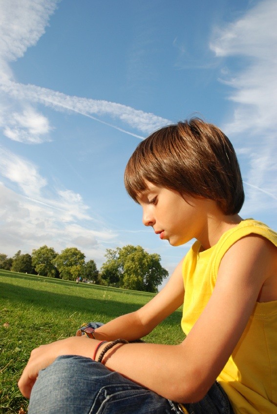 boy outside not taking part