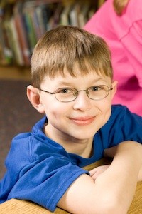 elementary kids reading books in library