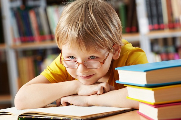 boy with glasses in the library 