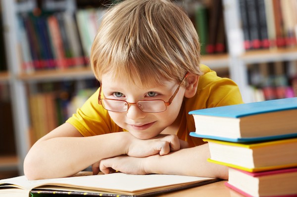 boy reading in school library