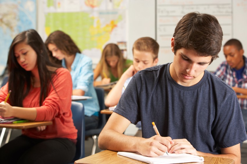 teen boy in class at school