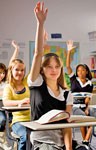 kids in classroom with hands raised