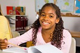 teacher giving student girl a reading test