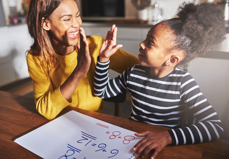 image of mom and daughter high five