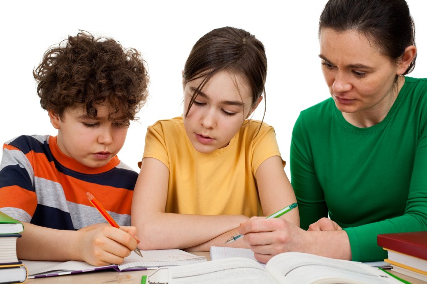 kids reading homework with mom