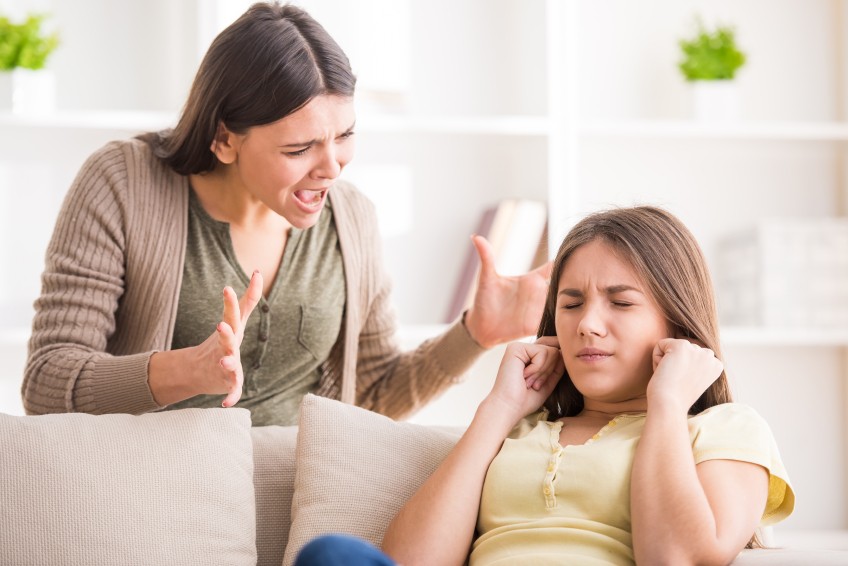 mom talking to a frustrated daughter