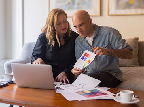 couple holding up a chart in a digital IEP meeting