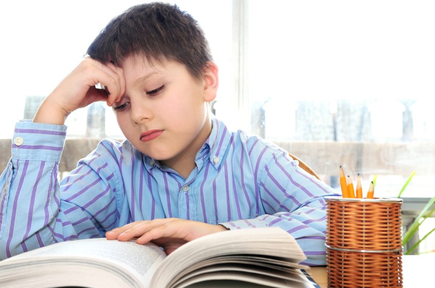 boy in class reading