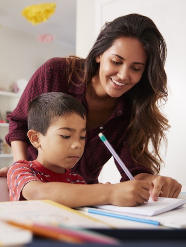 image of mom and sone working on school work