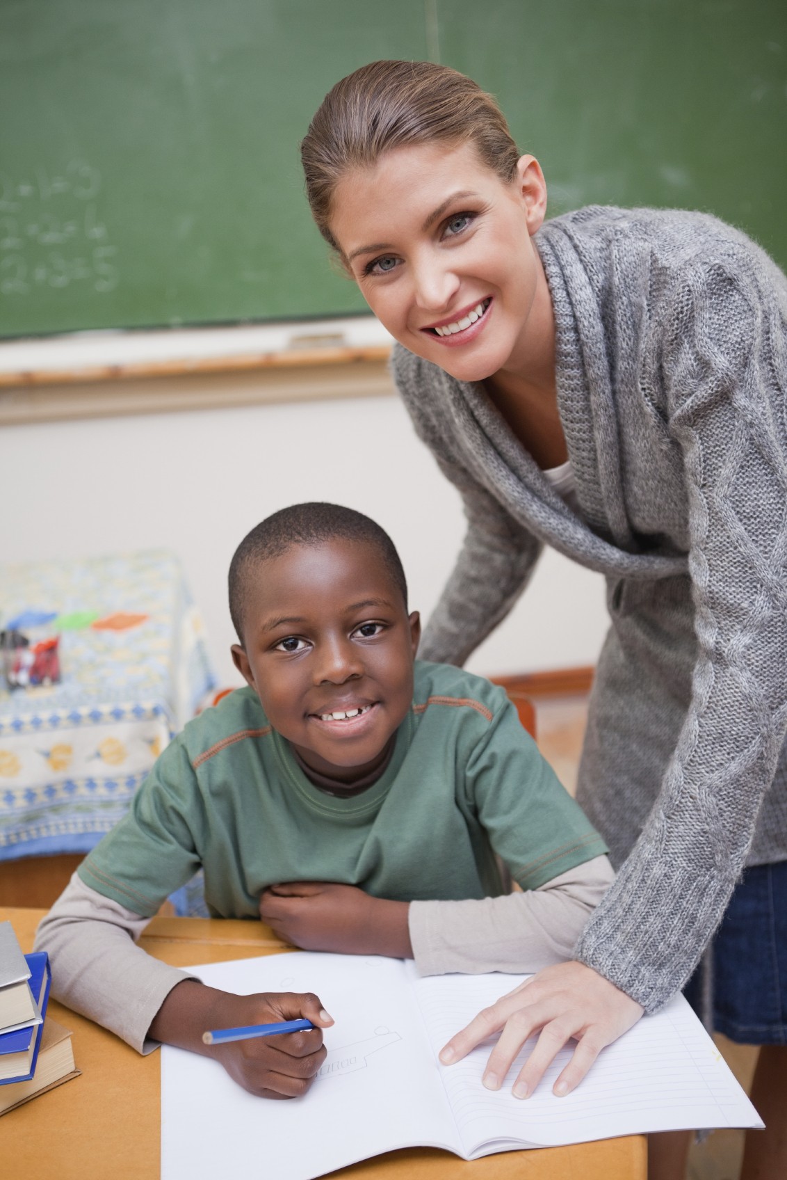 image of teacher and boy in classroom