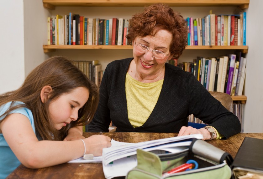 girl student with one to one paraprofessional aide 