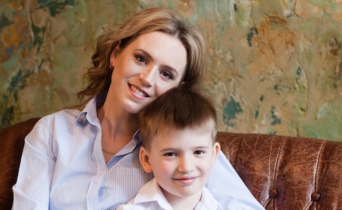 woman and boy sitting on a couch