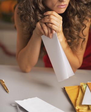 woman reading sad letter