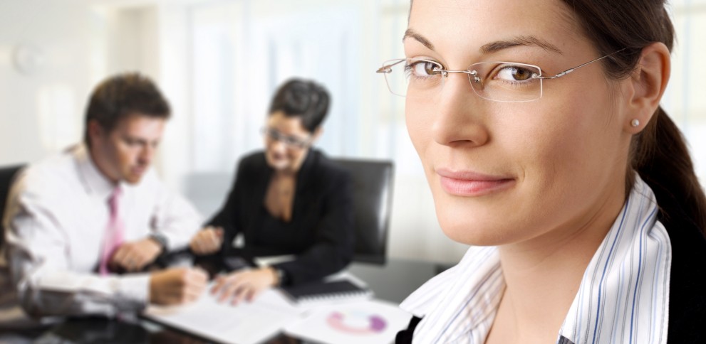 woman wearing glasses who is observing a mediation
