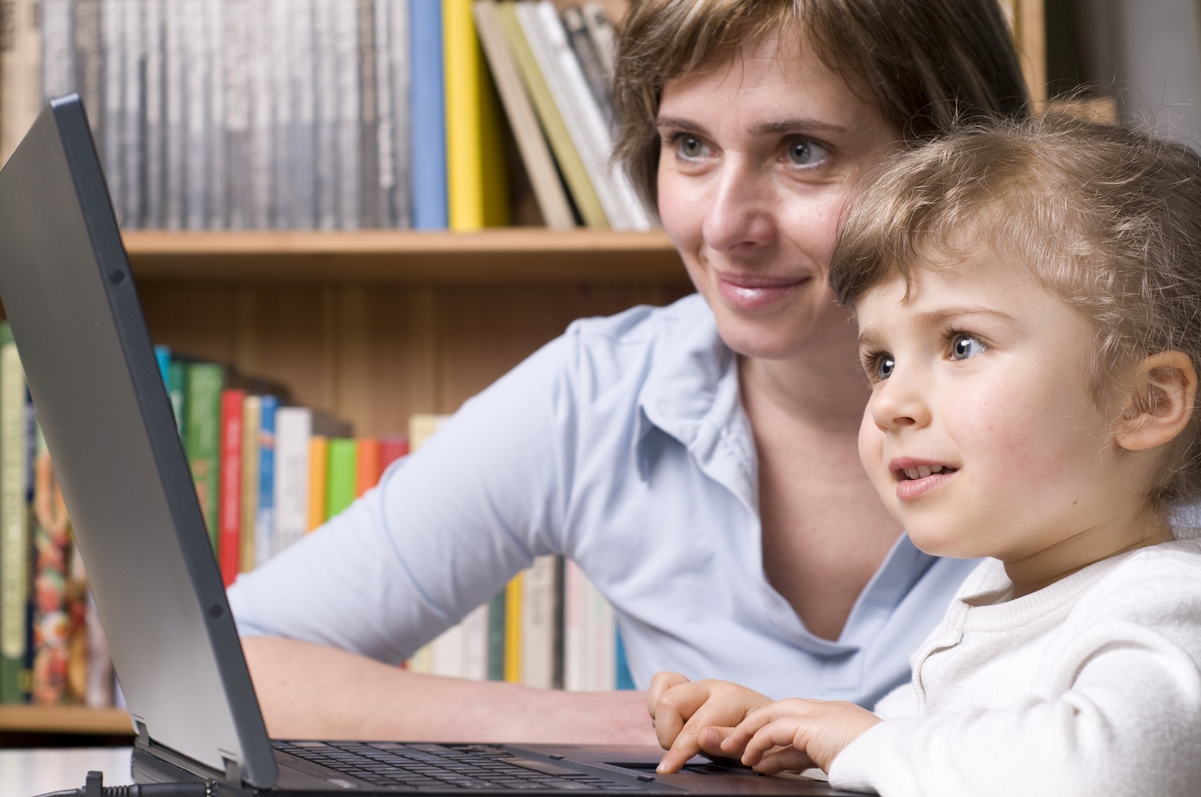 young girl and mother at computer