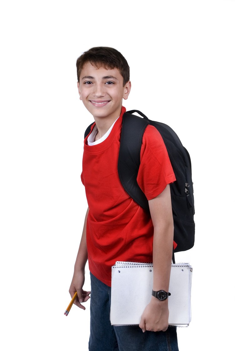 schoolboy with notebook and backpack