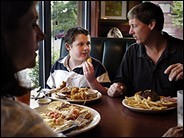 Photo of Stefan, Brian and Juliana Jaynes at restaurant taken by Mike Heffner for The New York Times