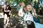 Yasmine Harrison swings at her home